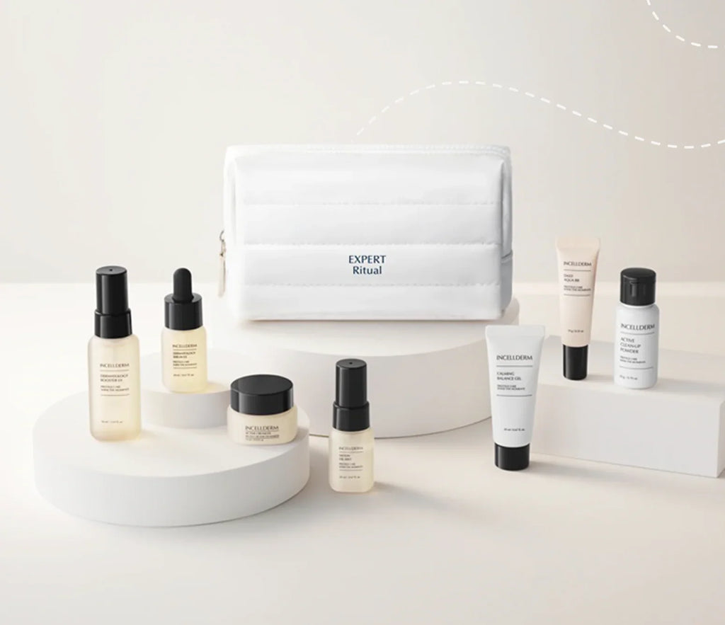 A skincare product set from Aesop's Expert Ritual collection, featuring a white zippered pouch and multiple bottles, jars, and tubes arranged on minimalist white pedestals against a clean white background.