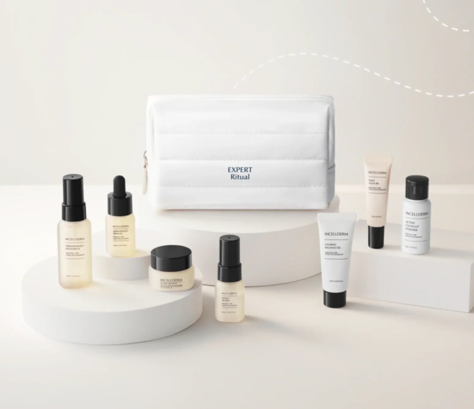 A skincare product set from Aesop's Expert Ritual collection, featuring a white zippered pouch and multiple bottles, jars, and tubes arranged on minimalist white pedestals against a clean white background.