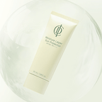 A tube of Moisture Layer Sun Protector SPF 50+ by Chantilly Organics, featuring a cream-colored tube with green text and logo, resting inside a clear glass sphere on a white background.